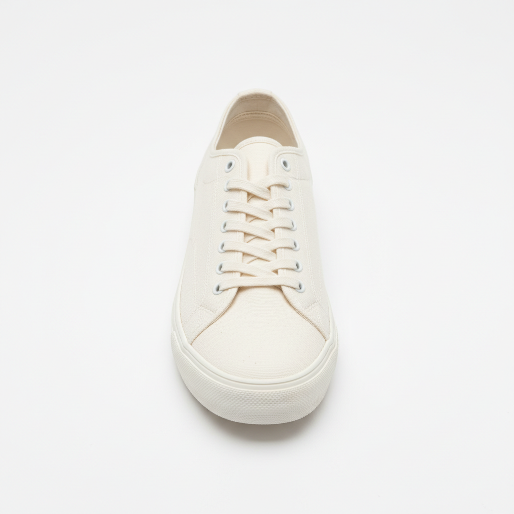 White low-top canvas sneakers on white background with clean minimal styling
