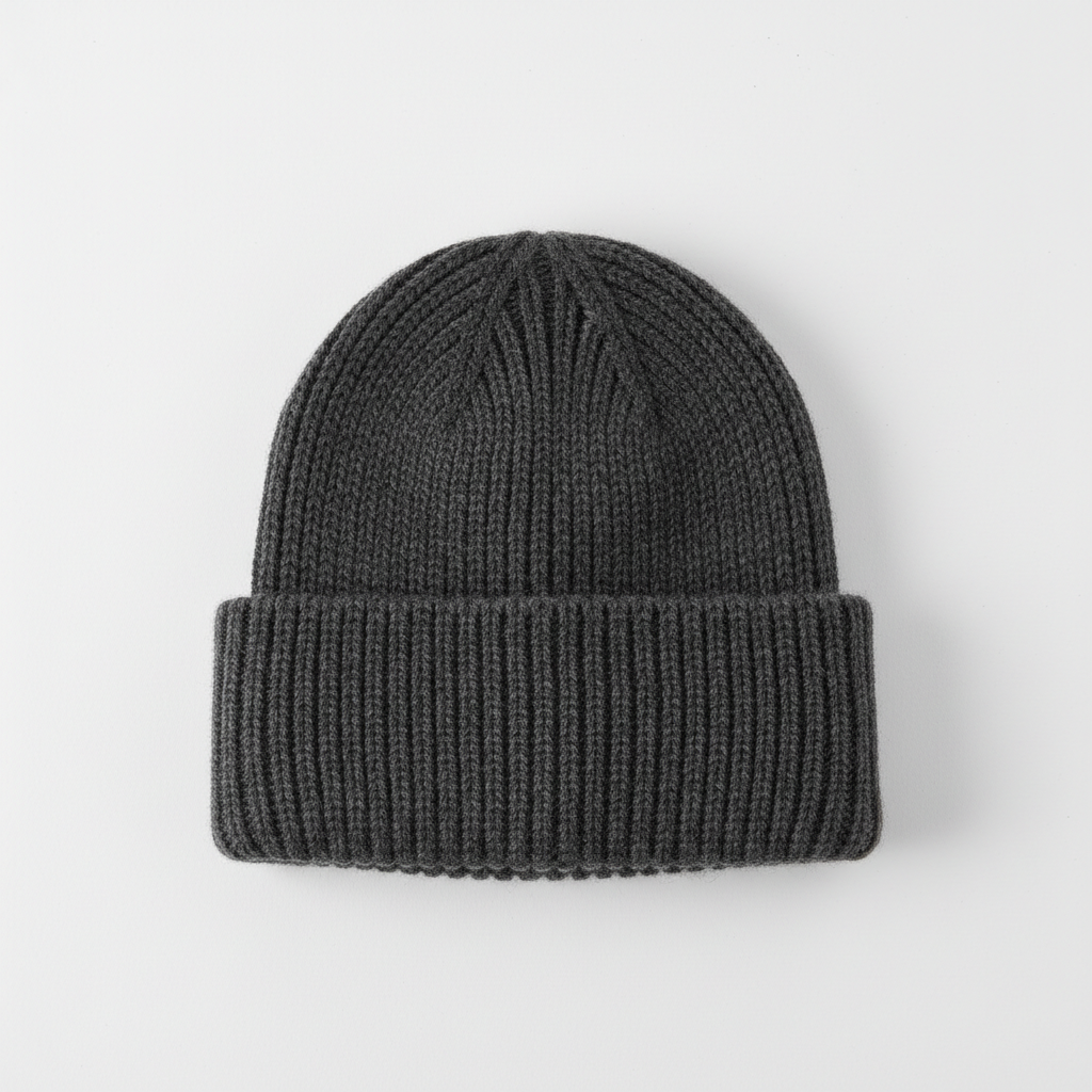 Charcoal grey merino wool athletic top folded neatly on light grey background