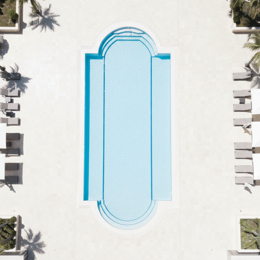 Hotel pool before — overexposed iPhone shot with no styling