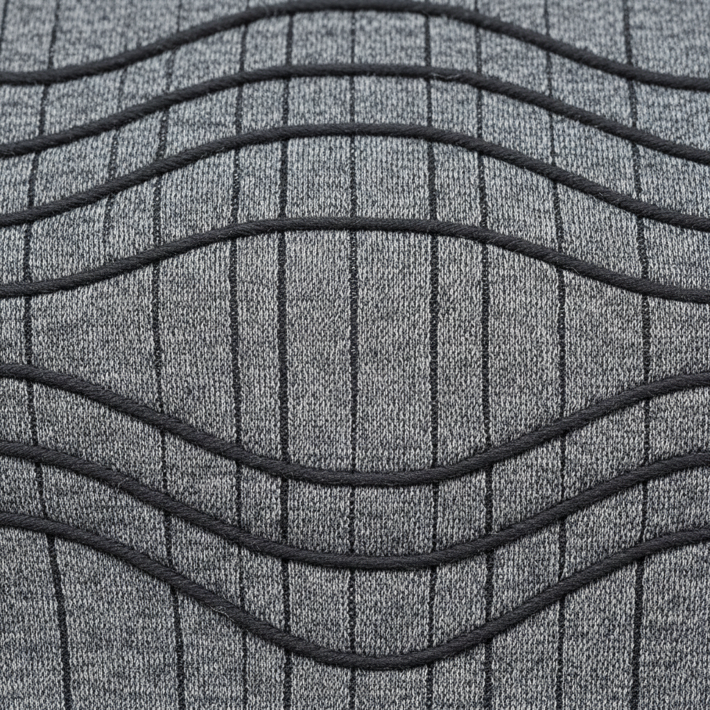 Compression fabric texture showing elastane-merino blend weave structure with defined stretch pattern