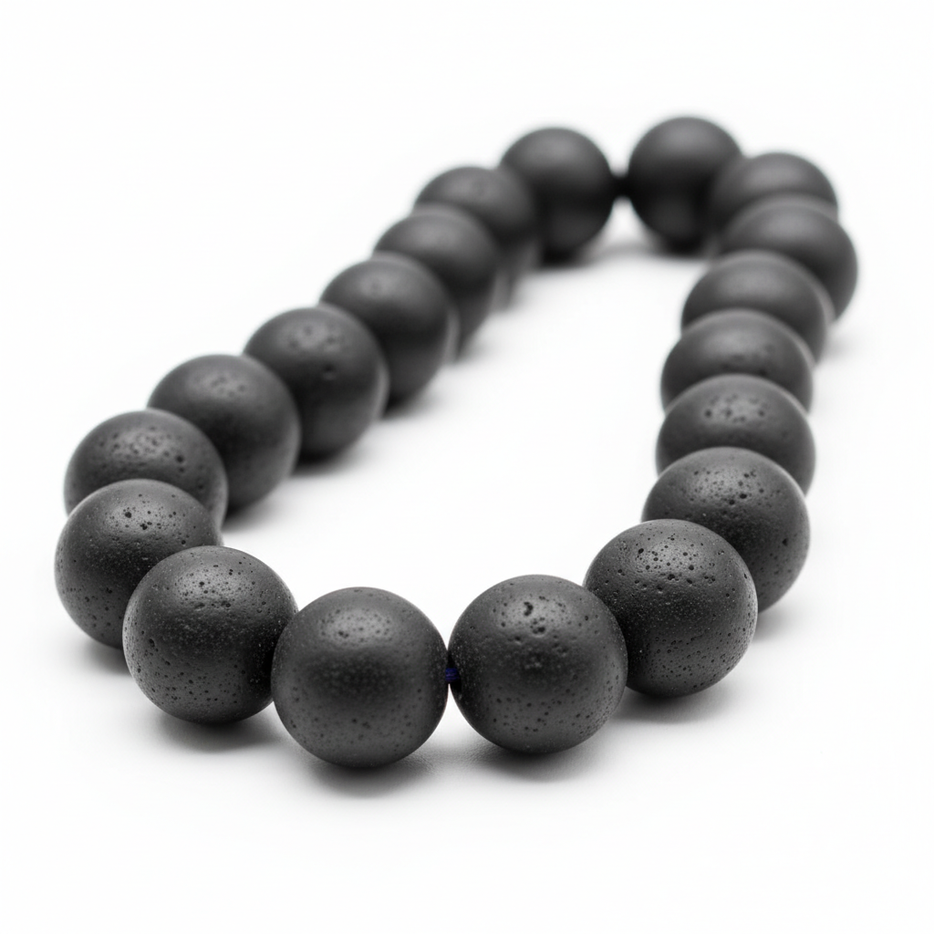 Black oltu stone beads on white background, matte finish