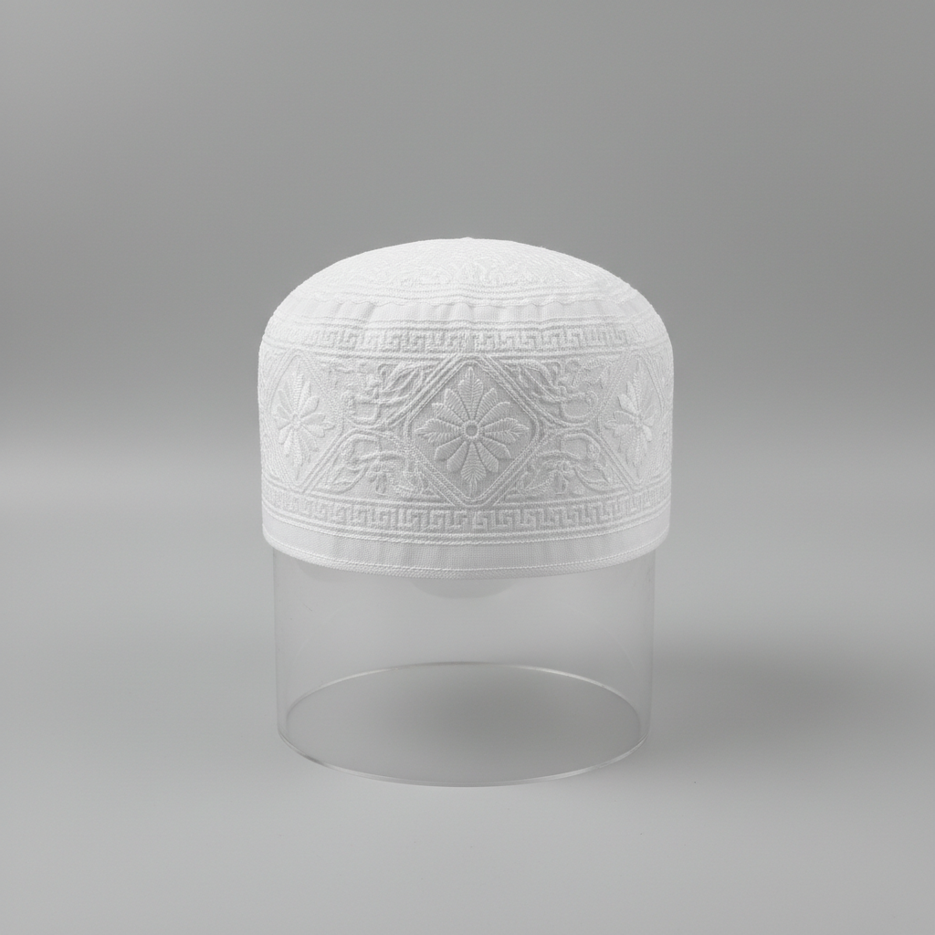 Ornate embroidered kufi cap, close-up detail, dark background