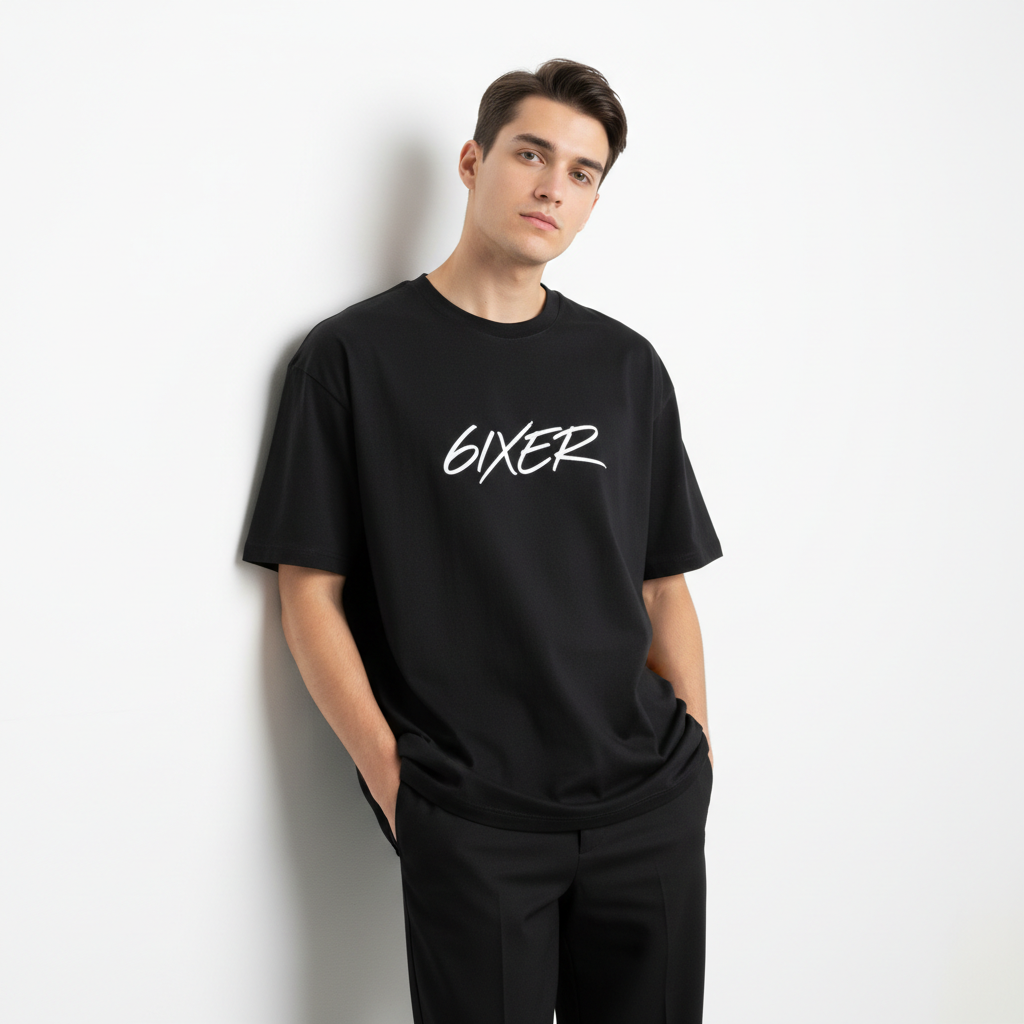 Model wearing oversized cotton tee with relaxed fit in a bright minimal studio