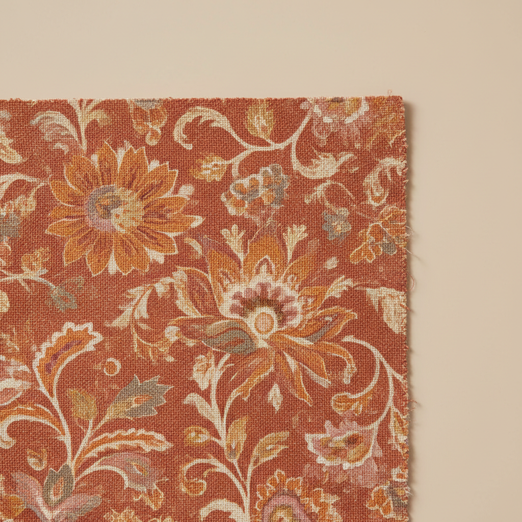 Warm terracotta floral pattern on cotton canvas swatch