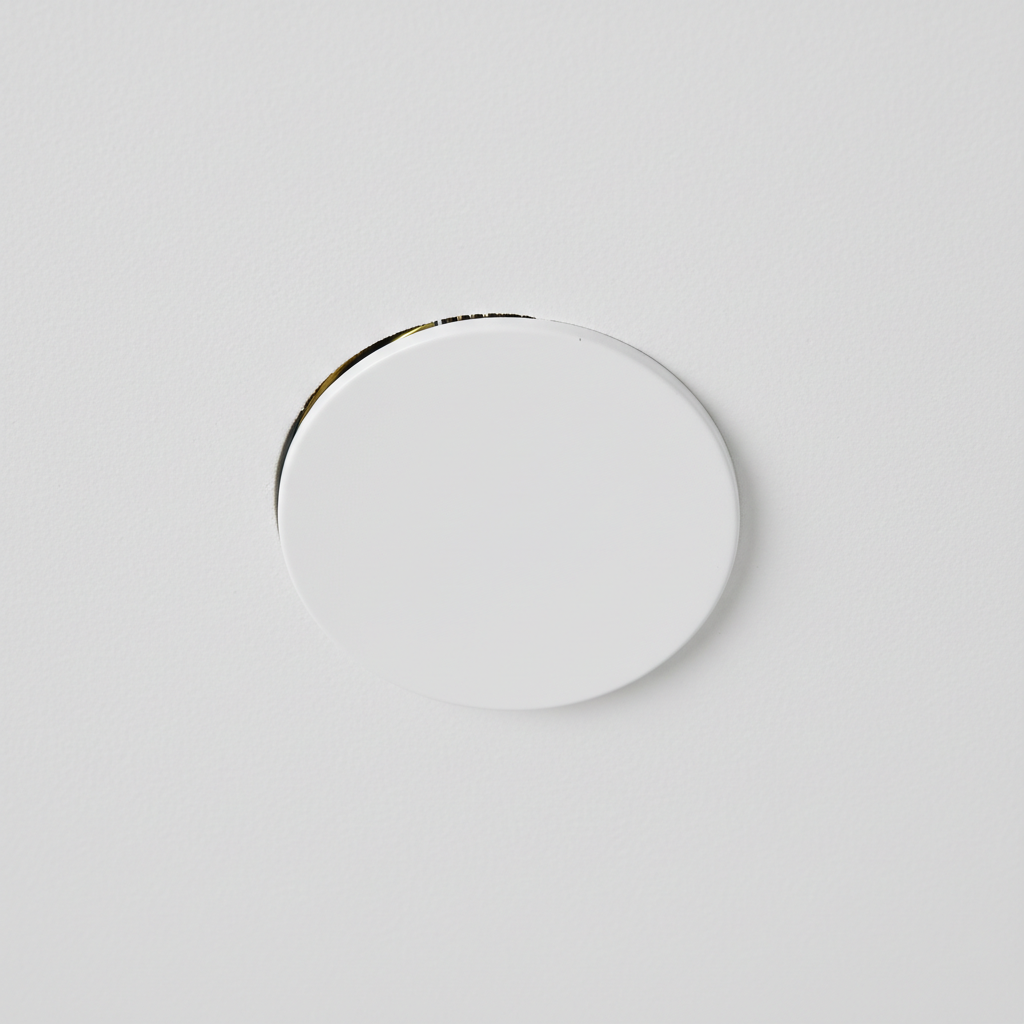 Luxury residential living room with high ceilings, subtle concealed sprinkler heads flush with white ceiling, warm interior lighting