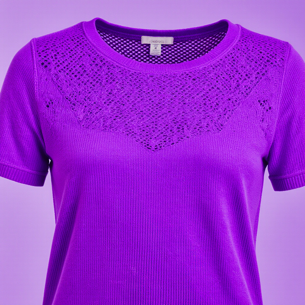 Fine jersey knit texture of school tee showing breathable open weave structure under violet light