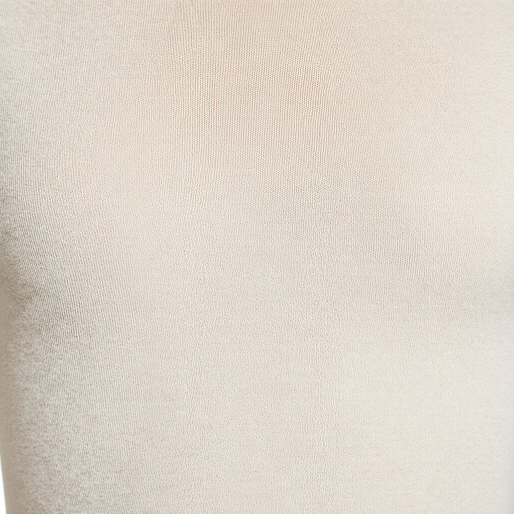 Ultra-close fabric texture of seamless base layer showing fine merino weave with uniform fiber structure